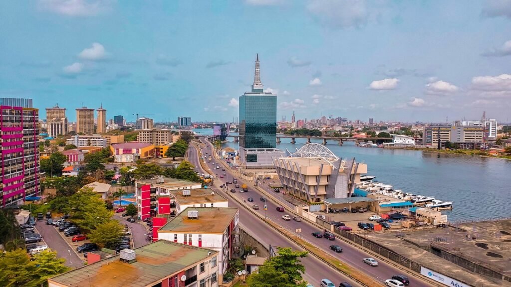 Lagos cityscape at dusk with traffic and high-rise buildings