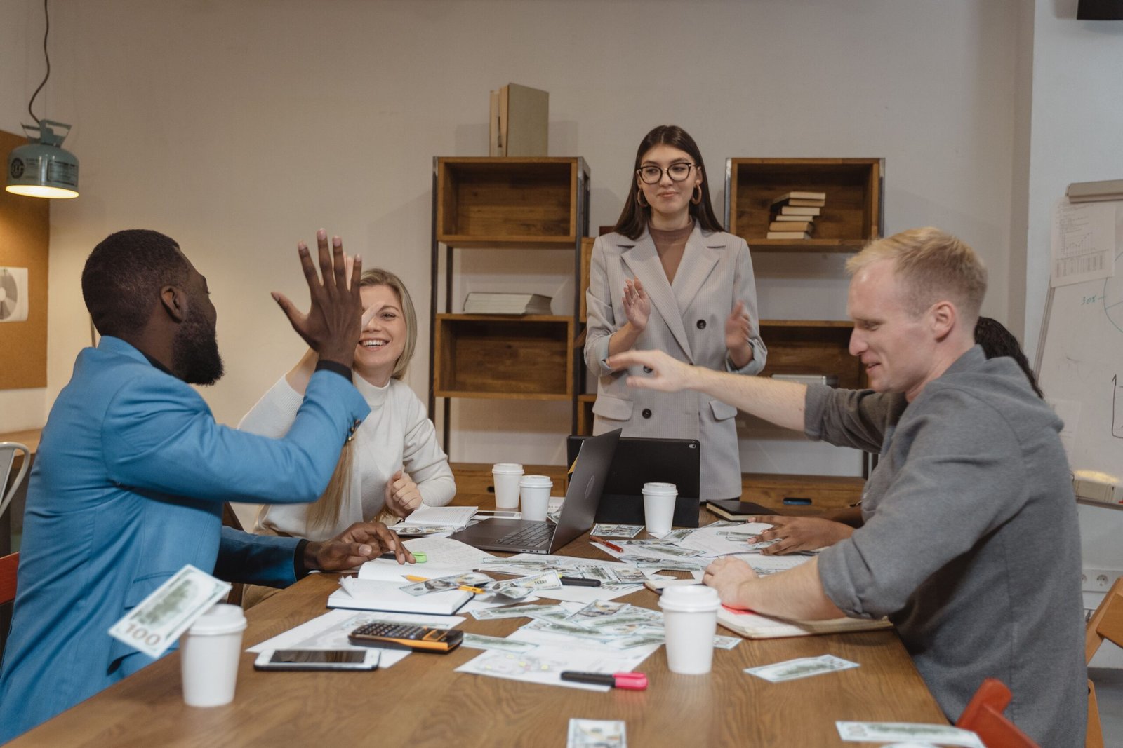 Group of people sitting around a brown wooden table — Photo by Tima Miroshnichenko on Pexels